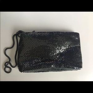 Small black clutch with wrist strap